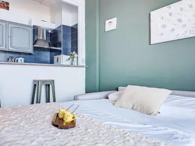 a bedroom with a bed with a toy on it at Studio Le Savoy Promenade des Anglais-5 by Interhome in Nice