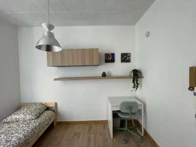 a bedroom with a bed and a desk in it at Studio au coeur de Nice in Nice