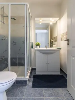 a bathroom with a sink and a shower and a toilet at Studio cœur de ville et au calme in Cagnes-sur-Mer