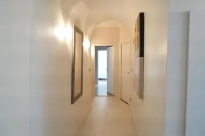 a hallway with two pictures on the walls at Villa La Mascotte in Beaulieu-sur-Mer