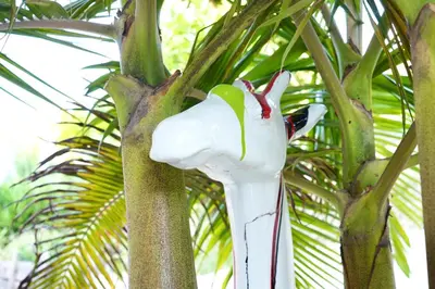 a statue of a flamingo hanging from a tree at Villa La Mascotte in Beaulieu-sur-Mer