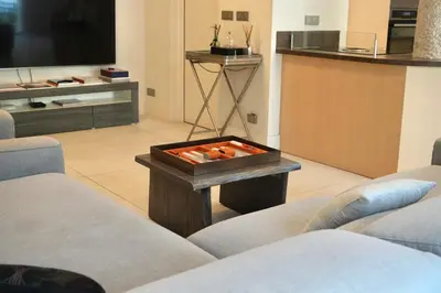 a living room with a fire pit in the middle at Villa La Mascotte in Beaulieu-sur-Mer