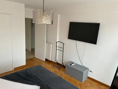 a living room with a flat screen tv on the wall at Nice vauban in Nice