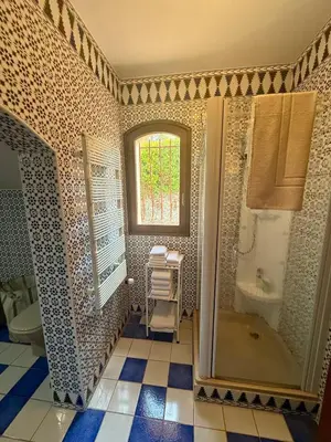 a bathroom with a tub and a sink at Havre de paix proche de Nice in Aspremont