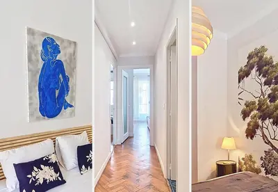 a bedroom with a blue painting on the wall at Nestor&Jeeves - PROMENADE DU SUD - Vue Mer in Nice