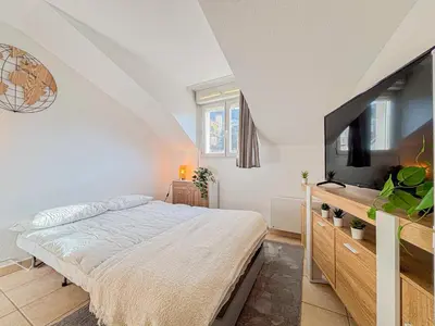 a bedroom with a bed and a flat screen tv at Etudiants Port - Riquier- Wifi, 2 pers in Nice