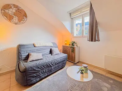 a living room with a couch and a table at Etudiants Port - Riquier- Wifi, 2 pers in Nice