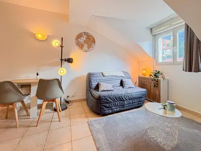 a living room with a couch and a table at Etudiants Port - Riquier- Wifi, 2 pers in Nice