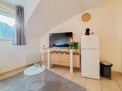 a living room with a refrigerator and a tv at Etudiants Port - Riquier- Wifi, 2 pers in Nice