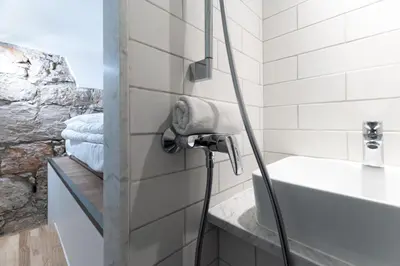a bathroom with a bath tub and a sink at Etudiants port - 1pers, wifi, AC in Nice