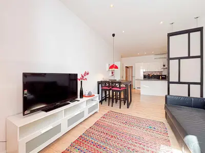 a kitchen with a door open to a living room at Stalingrad - Wifi, AC, 4pers in Nice