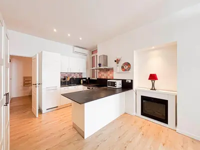 a kitchen and living room with a washer and dryer at Stalingrad - Wifi, AC, 4pers in Nice