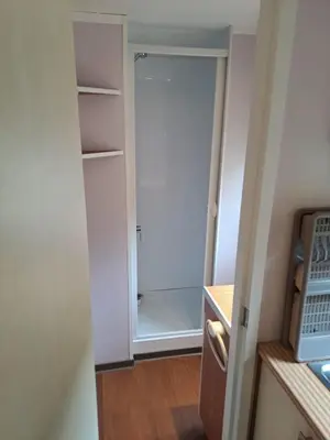 a closet with a door open in a room at Mobil home Oasi in Cagnes-sur-Mer
