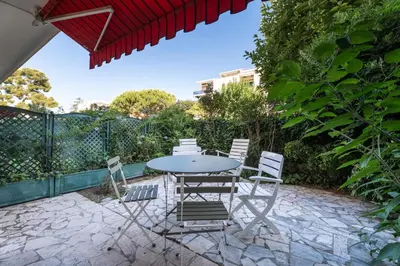 a table and chairs sitting on a patio at Studio Mimosas - Welkeys in Cagnes-sur-Mer
