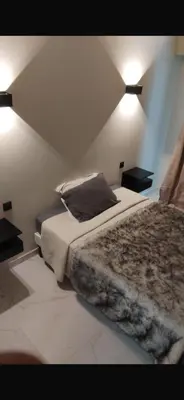 a bedroom with a bed and two night stands at Nice in Nice