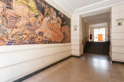 a large painting on the wall of a hallway at L4 Fayad 2BDR Hotel des Postes Central, Massena AC 2Balconies in Nice