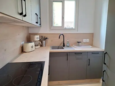 a kitchen with a sink and a stove top oven at Arty & Chic à Nice in Nice