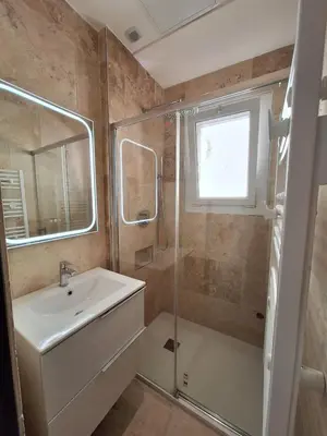 a bathroom with a sink and a shower at Iconic and bright style in Nice in Nice