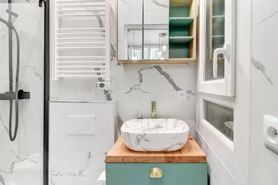 a bathroom with a bowl sink on a wooden counter at Pearl of Nice in Nice