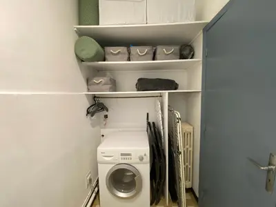 a laundry room with a washer and dryer at Easy and accessible beach flat near the university in Nice