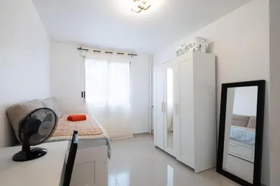 a white room with a mirror and a bed at Azur Stay 3 Start Beach 8 min Tram Airport 5m in Nice