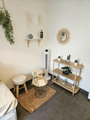 a living room with a table and two chairs at Charming studio in Nice