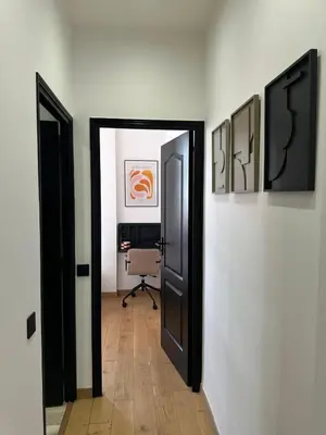 a hallway with two doors and a chair in a room at Chic et confort- Nice- 3 à 5 personnes in Nice