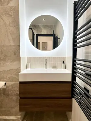 a bathroom with a sink and a mirror at Chic et confort- Nice- 3 à 5 personnes in Nice