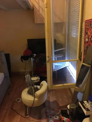 a living room with a glass door and a table at Teranga in Nice