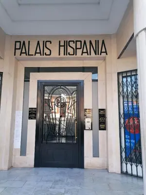 a door to a building with a sign that reads palas hacienda at Teranga in Nice