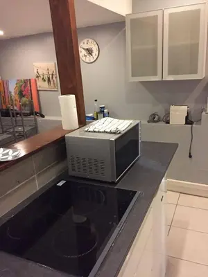 a microwave sitting on a counter in a kitchen at Charmant studio Nice in Nice