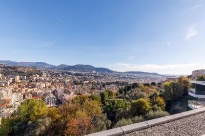 a view of a city from a building at Green Hill Appartement à Nice Terrasse 130m2, Vue panoramique, Piscine, Parking Privé, Climatisation, WiFi in Nice