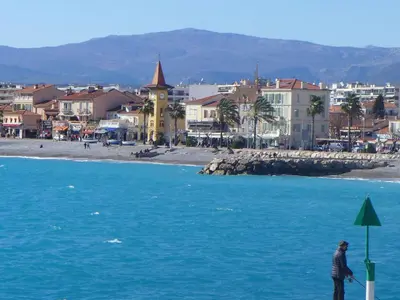 a person standing on the beach near the water at Studio Le Bali by Interhome in Cagnes-sur-Mer