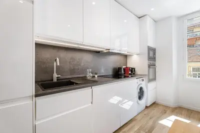 a white kitchen with a sink and a dishwasher at Nice Renting - REPUBLIQUE - Garibaldi Chic 3 Bedrooms 3 Bathrooms Balcony AirCon in Nice