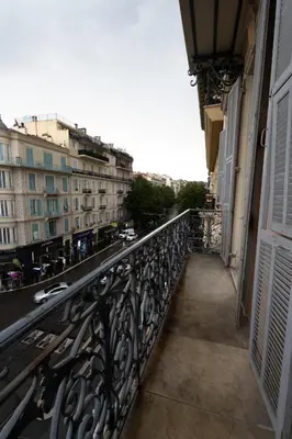 a balcony with a view of a street and buildings at Le Malausséna in Nice