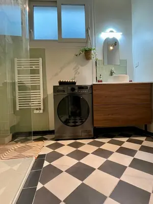 a washing machine in a bathroom with a sink at Jeanne Darc in Nice