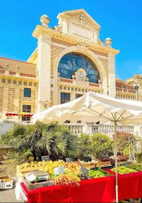 a display of fruits and vegetables in front of a building at Jeanne Darc in Nice