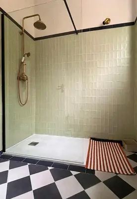 a bathroom with a shower and a bath tub at Jeanne Darc in Nice