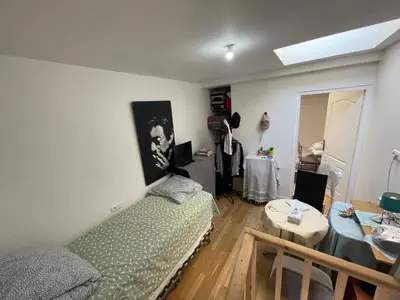 a living room with a couch and a table at Room in city Nice in Nice