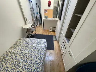 an overhead view of a room with a bed and a bathroom at Room in city Nice in Nice
