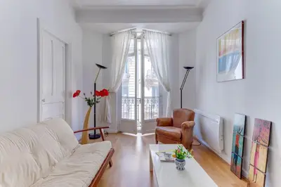 a living room with a white couch and a chair at LE CONCORDIA AP4478 by RIVIERA HOLIDAY HOMES in Nice