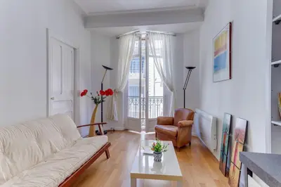 a living room with a couch and a table at LE CONCORDIA AP4478 by RIVIERA HOLIDAY HOMES in Nice