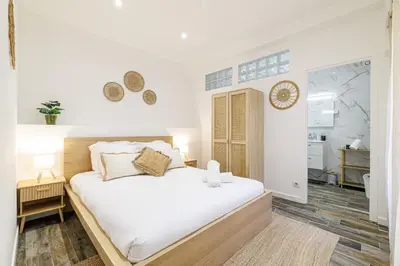 a bedroom with a large white bed in a room at Ultra Central Rue Massena 1 Bdr in Nice