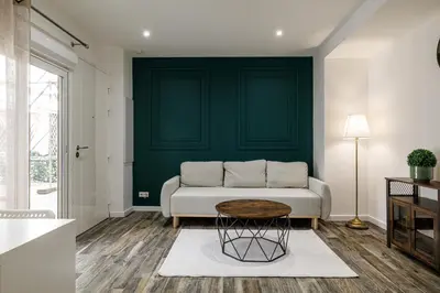 a living room with a couch and a table at Ultra Central Rue Massena 1 Bdr in Nice