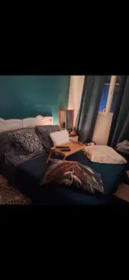 a bedroom with a bed with a laptop on it at Magnifique appartement a la mer in Nice