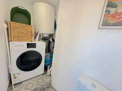a washing machine in a corner of a room at ⁂ Cocon ensoleillé proche de la plage in Nice
