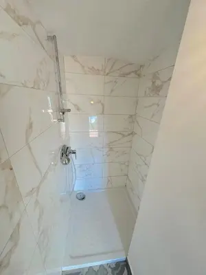 a bathroom with a shower with a sink and a tub at ⁂ Cocon ensoleillé proche de la plage in Nice