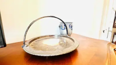 a metal plate on a table with a candle at Sublime 2 bedroom spacious and bright AC Private parking in Nice