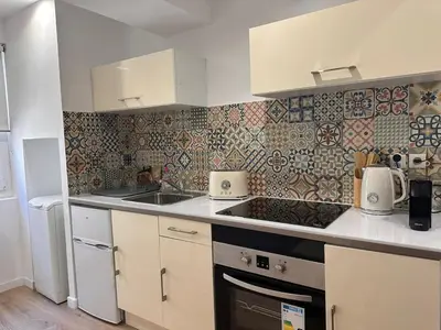 a kitchen with a sink and a counter top at Appartement rénové Vieux Nice in Nice