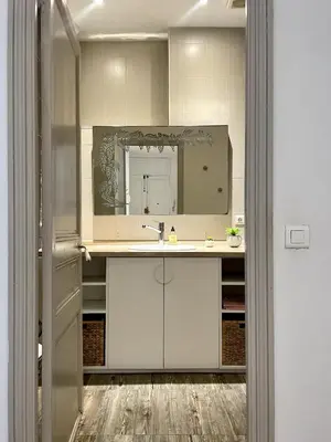 a bathroom with a sink and a mirror at Close to sea center apartment 130m2 in Nice